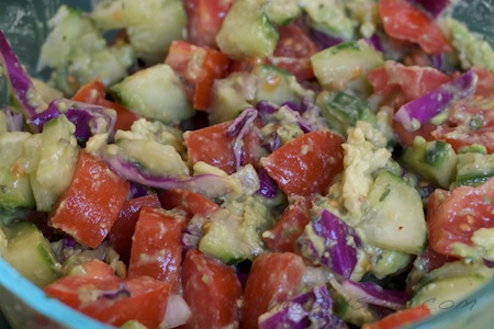 Avocado salad with cukes, onion, tomatoes, cabbage and lime
