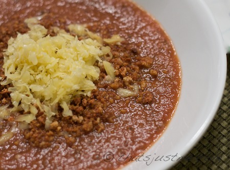 eggplant parmesan soup topped with bread crumbs and cheese