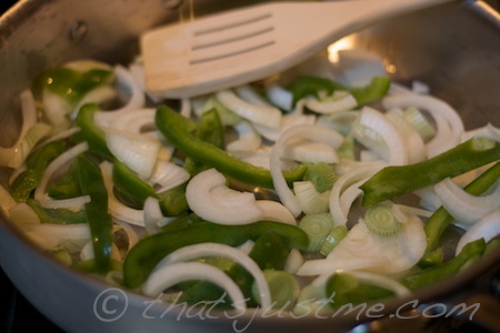 using fry pan, saute peppers and onions with olive oil