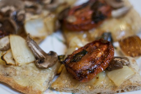 yummy roasted tomato onion pizza with mushrooms